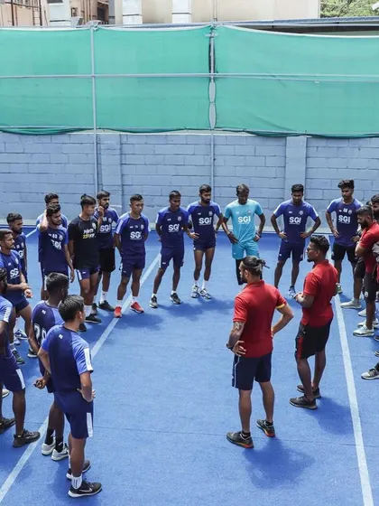 Our process with professional clubs is built on clarity and trust. This image shows a team huddle with Sporting Club Bengaluru, a partnership that resulted in an I-League 2 championship with zero games missed due to injury.