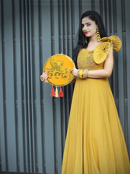 The perfect gown for a fun and festive Haldi ceremony, available for rent.