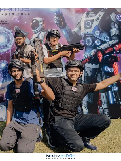Victory pose! This group is celebrating after a competitive laser tag match. It's a fantastic activity for building camaraderie and creating fun, lasting memories with your friends.