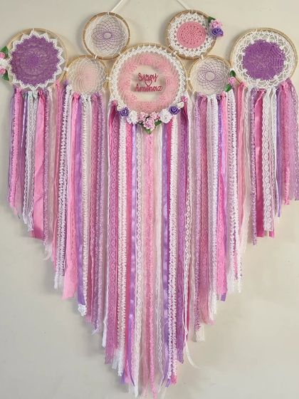 The hues of pink in this floral cluster dreamcatcher capture the essence of serenity and grace. It's an enchanting piece that inspires a renewed sense of hope.