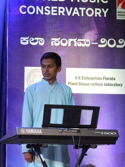 A student performing a devotional piece on the keyboard, showing our diverse musical training.