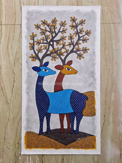 A finished Gond art painting featuring a pair of deer. This piece, created for an architect's project, showcases the fine lines and imaginative patterns typical of this traditional Indian folk art style.