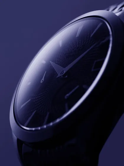 A moody, atmospheric close-up of the Argos Olympus. The deep blue monochrome lighting creates a sense of mystery and focuses entirely on the watch's form and the subtle texture of the dial. It’s about evoking a feeling, not just showing a product.