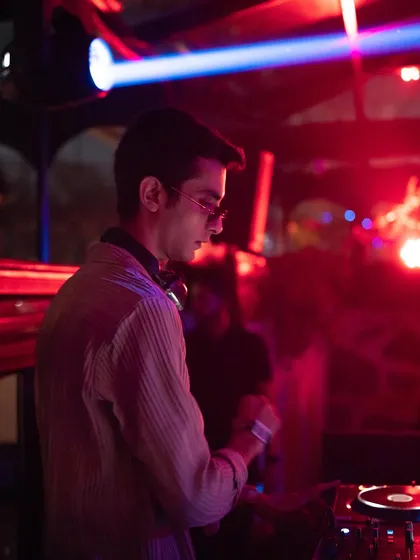 A still from the &me afters, where the mood was set with deep, hypnotic Afro House music under the red lights.
