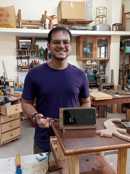 Anish created this clever mobile phone stand with a built-in wireless charger. The base is made from MDF flooring, and a pencil acts as an adjustable prop.