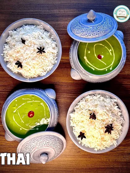 A serving of my Thai Green Curry with rice, showcasing the beautiful ceramic serveware I use to make your dining experience special.