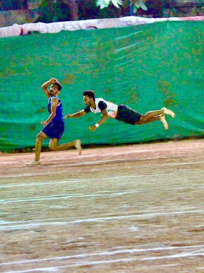 A perfectly timed dive to tag the runner. This image captures the split-second decisions and commitment required in Kho-Kho.