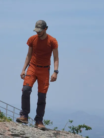 Geared up and ready for a day of trekking. Proper attire, like these convertible trek pants and sturdy boots, is key for a comfortable hike.