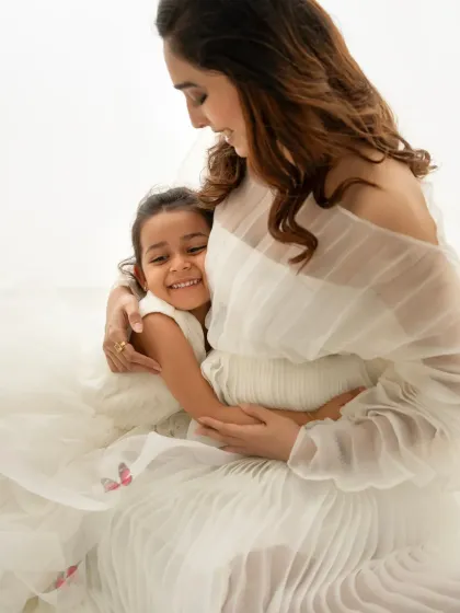 Welcoming a new baby is a family affair. I love including older siblings in my sessions, capturing these precious moments of bonding before the family grows. This sweet hug is a memory they'll both cherish forever.