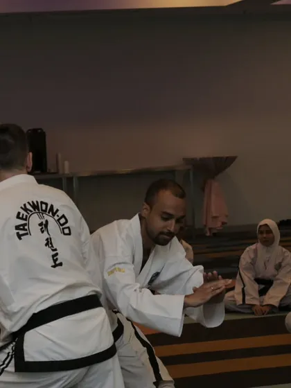 Receiving a correction on my form from another instructor. This collaborative learning environment is what makes these seminars so valuable.