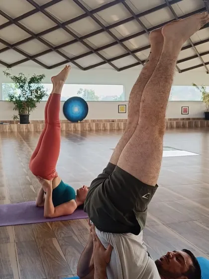 A different angle of guests in Sarvangasana. We encourage our guests to challenge themselves gently, improving flexibility and strength at their own pace.