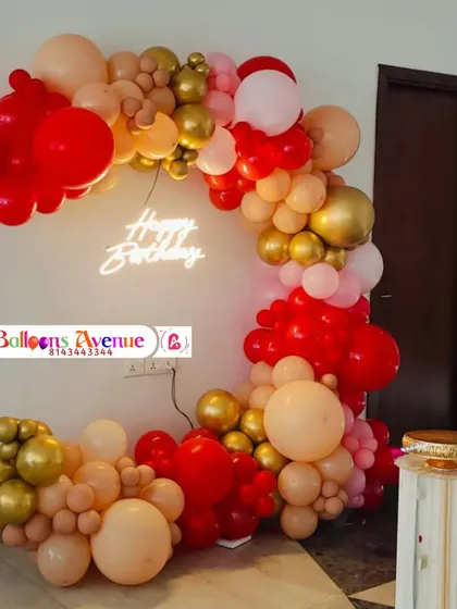 The full red and gold birthday setup, showing its placement in the corner of a room.