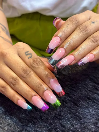 Why choose one color when you can have a rainbow? This is a fun twist on the French manicure, with each nail featuring a different metallic chrome color on the tip for a playful look.