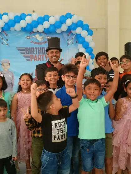 So much energy. Posing with a group of happy kids after a super fun birthday party show. Seeing these smiles is the real magic for me.