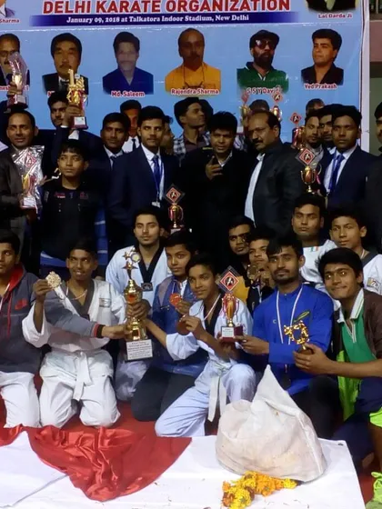 A group photo of our entire delegation of champions and instructors at the national karate organization event.