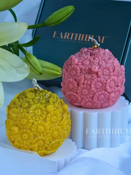 The floral sphere candle in sunny yellow and pink, perfect for brightening up any room.