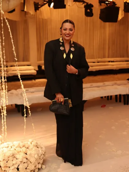 Another angle of my India Couture Week look. The structured blazer and sleek bun create a sharp, modern contrast to the softness of the saree.