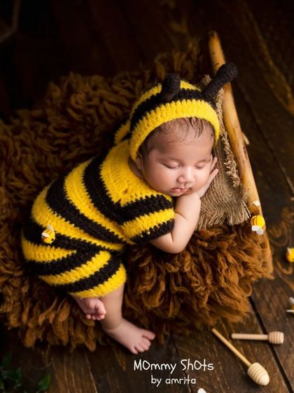 The adorable "bumblebee" setup, a perfect example of how creative costumes and themed props can result in playful and unique portraits.