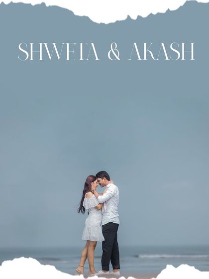 A minimalist and artistic portrait against the vastness of the sea and sky. This style of outdoor engagement photography uses negative space to create a feeling of serenity and focus on the couple.