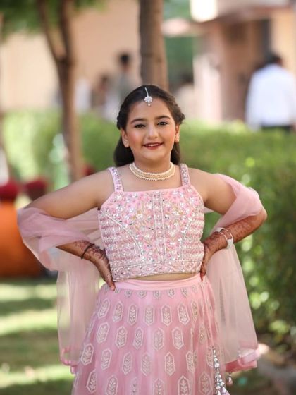 The bride's little sister, looking absolutely adorable. I created a very light, age-appropriate look with a touch of shimmer to make her feel special.