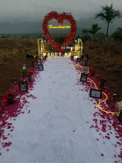 An angled perspective of the outdoor proposal setup, highlighting the contrast between the rustic, natural surroundings and our elegant, romantic decoration.