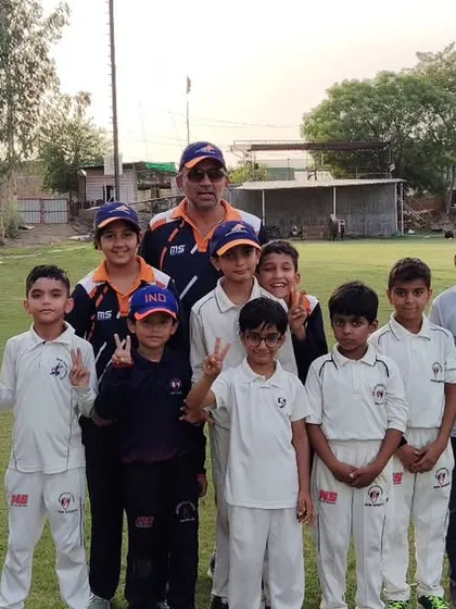 Another happy moment with the future stars of cricket. We believe in creating a supportive community where every player feels valued.