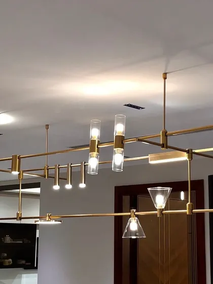 Meet the MMDLS Chandelier, a fully modular lighting system that puts you in the designer's seat. This fixture allows you to adjust, reposition, and combine different lighting elements to create a truly personalized chandelier for your space.