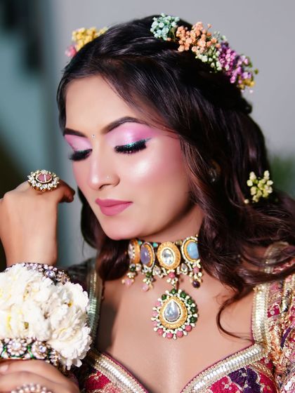 A close-up of the pretty pink eye makeup. This is a look that is both trendy and timeless for a Mehndi function.
