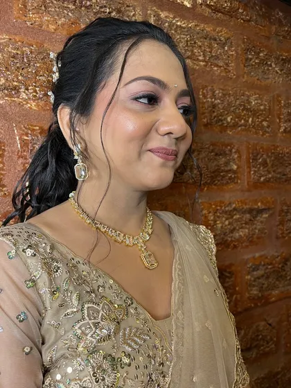 The makeup is designed to be long-lasting and photogenic, even through a night of celebration.