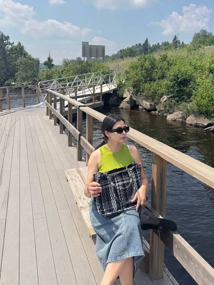 Sitting on a boardwalk bench in Huntsville, this shot captures a relaxed moment during a day of exploring.