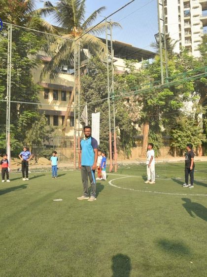Our coaches lead a training session on the turf at Don Bosco Nerul. This image captures the professional environment we establish at all our partner locations.