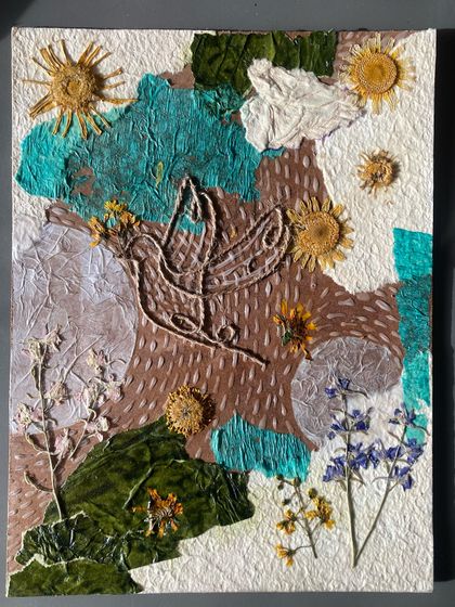 This student incorporated dried flowers and leaves directly into their collagraph plate. This technique, combined with string and textured paper, creates a wonderfully organic and multi-layered piece of art.