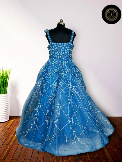 Another view of the royal blue gown, showcasing its elegant design from a different angle.