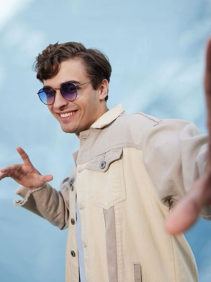 A fun, youthful look for the Titan Eye+ campaign. I used a two-tone denim jacket and colored sunglasses to create a playful and approachable vibe that connects with a younger demographic.