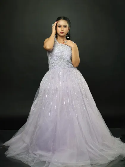This full-length view highlights the vertical lines of sequins on the skirt, which elongate the figure and add a subtle sparkle.