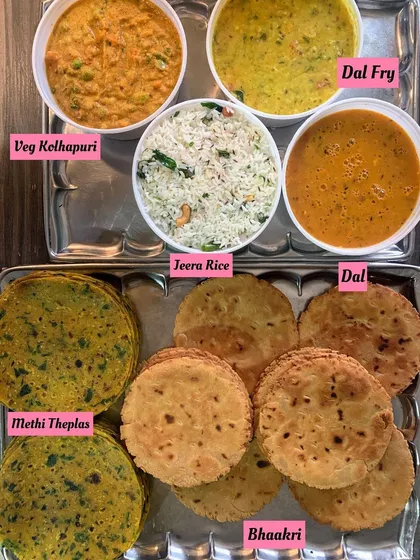 A simple and delicious meal with Methi Theplas, Bhaakri, Veg Kolhapuri, and Jeera Rice.