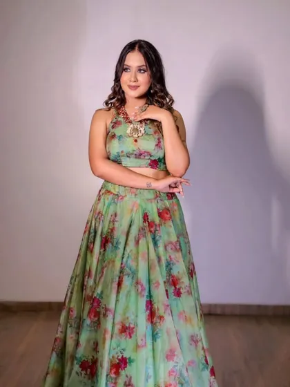 A fresh and vibrant light green floral lehenga. This is a perfect outfit for a daytime Mehendi or Haldi function, offering a light and breezy feel.