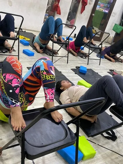 This supported inversion pose uses the chair to help students gently stretch their back and hamstrings while improving circulation.