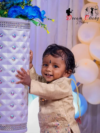 The pure joy of a birthday celebration. This little one's happy smile, surrounded by festive decorations, is exactly the kind of candid moment I aim to capture so you can remember it forever.