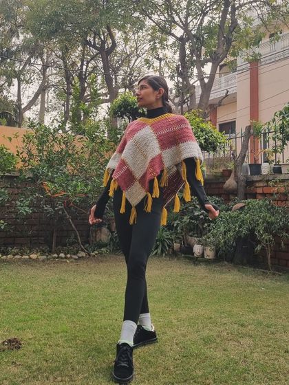 Another shot of this beautiful poncho. The combination of pink, grey, and mustard yellow is one of my favorites for the fall and winter seasons.