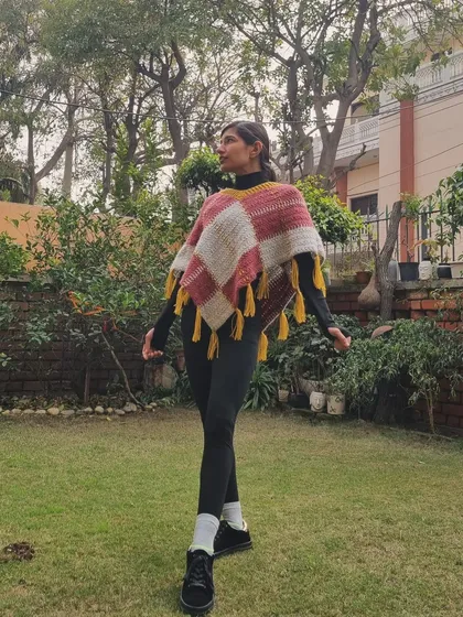 Another shot of this beautiful poncho. The combination of pink, grey, and mustard yellow is one of my favorites for the fall and winter seasons.