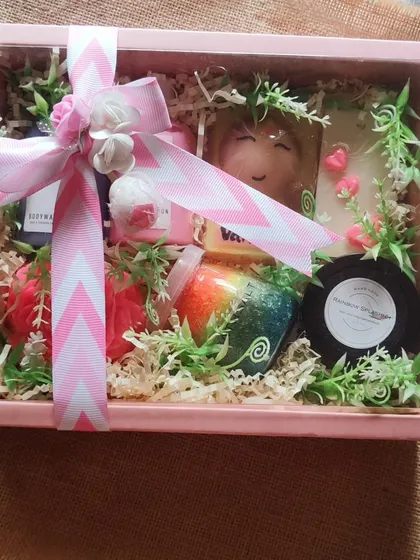 The fully assembled and wrapped bridesmaid gift box, complete with a beautiful ribbon and greenery.
