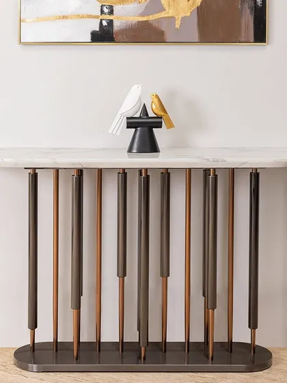The Timeless Console Table features a unique base with vertical rods in contrasting finishes, creating a striking visual effect. It’s the perfect piece to create a special focal point in your entry foyer or lobby.