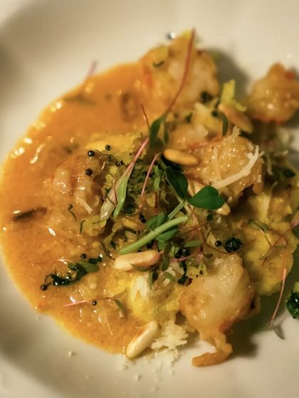 A fusion of Gujarati and Italian influences, this Shrimp Khandvi Gnocchi is served with a sweet and sour sauce and grilled sweet shrimp, finished with a sizzling tadka.