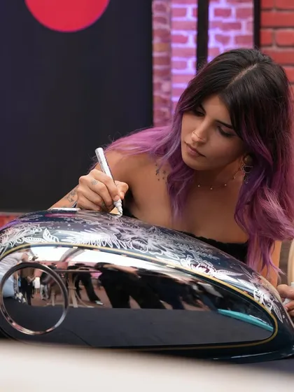 A shot of me doing live illustration on a BSA motorcycle tank at their launch event. The chrome surface was a unique challenge.