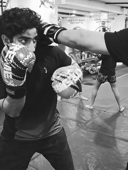 The eyes tell the whole story. This is the focus and intensity we build in every striking class. It's not just about throwing punches; it's about reading your opponent and staying sharp under pressure.