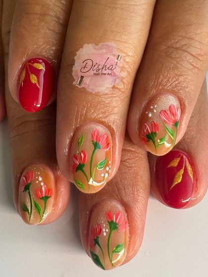 A festive and floral design. This set combines a bold red with sheer accent nails featuring hand-painted red flowers and gold leaves.