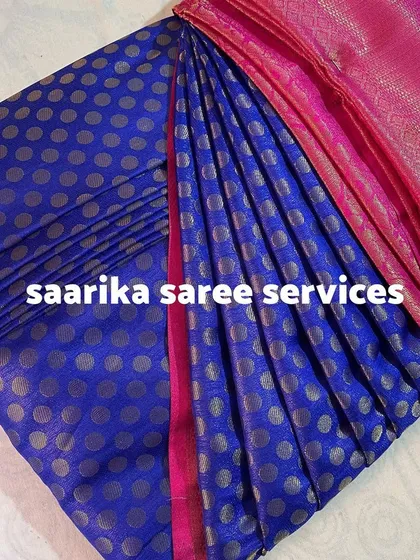 A blue saree with silver polka dots, a result from an offline workshop.