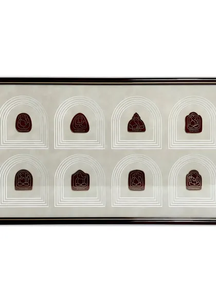 The full view of the framed Ganesha emblems. The combination of the 100% solid wooden frame and the intricate, multi-layered suede mat creates a true masterpiece that elevates the collection.