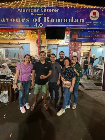 A group of friends posing for a photo in front of our festival entrance. We love being a place where friends can gather and celebrate.